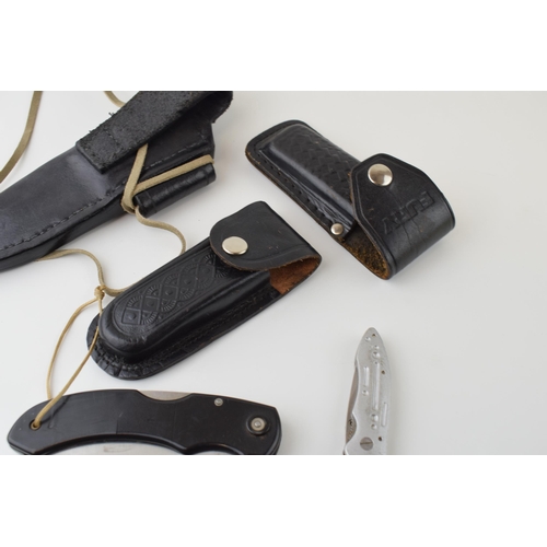 67 - A collection of leather knife belt pouches and sheaths together with three Marksman knives. (Qty)