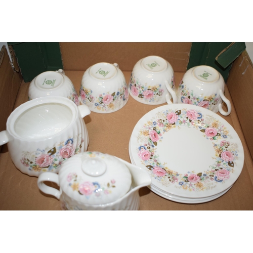 7 - Minton part tea service in the 'Rose Garland' pattern to include four cups four saucers and five sid... 