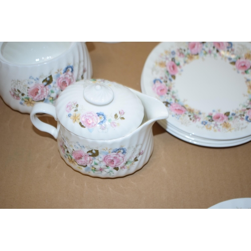 7 - Minton part tea service in the 'Rose Garland' pattern to include four cups four saucers and five sid... 