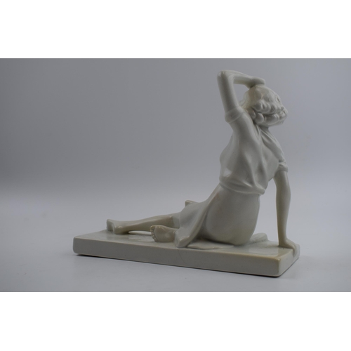 221 - Art Deco figure, circa 1930s, of a lady sat wiping her brow, indistinct marks to base, perhaps reads... 