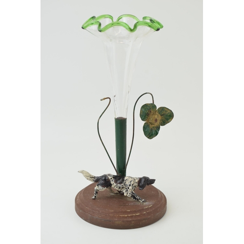 217 - A cast metal posy holder with associated glass vase with a gun dog, with a metal flower, 25cm tall.