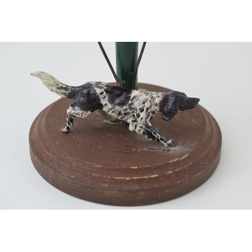 217 - A cast metal posy holder with associated glass vase with a gun dog, with a metal flower, 25cm tall.