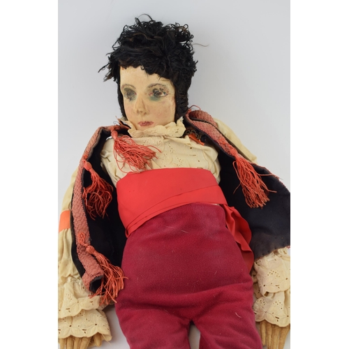 221 - A Boudoir doll in later handmade clothing. Height 70cm.