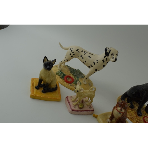 103 - A collection of Royal Doulton figures to include 'Dalmation' Utility Dog Collection RDA7, with 'Blac... 