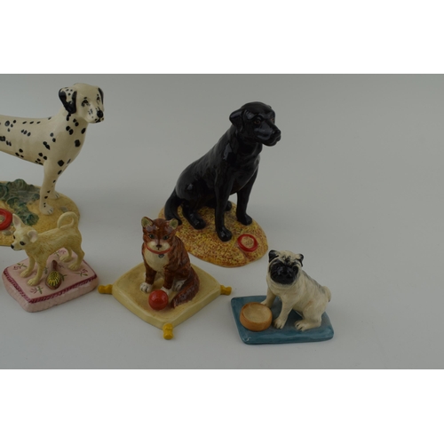 103 - A collection of Royal Doulton figures to include 'Dalmation' Utility Dog Collection RDA7, with 'Blac... 