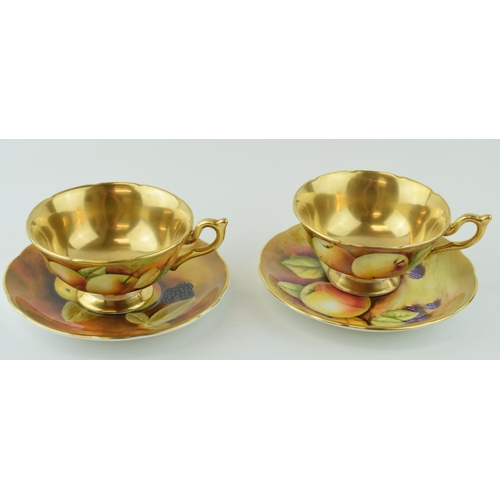 141 - Two hand-painted Coalport cabinet cups and saucers signed by J Mallram and C. Gidman. Heavy gilding.... 