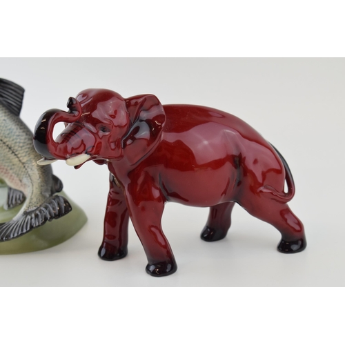 15 - A Beswick Salmon 2066 (one fin af), with a Royal Doulton flambe elephant (trunk af) (2).