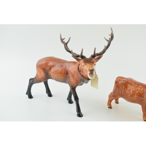 24 - Border Fine Arts pottery to include a Red Stag A5270 with antlers together with a Highland Cow (2).