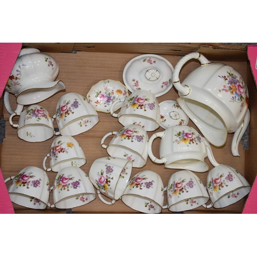 57 - A large collection of Royal Crown Derby tea ware and similar in the Derby Posies pattern to include ... 