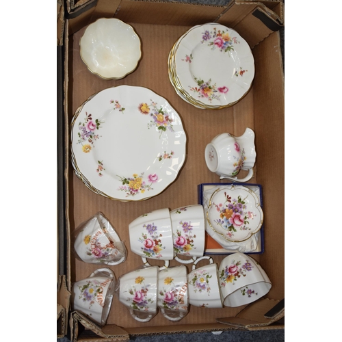 57 - A large collection of Royal Crown Derby tea ware and similar in the Derby Posies pattern to include ... 