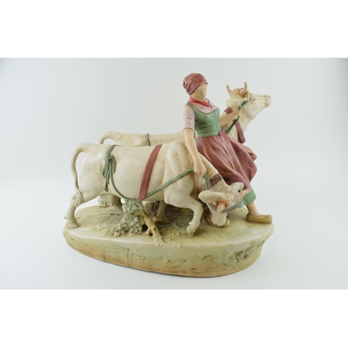 73 - Large Royal Dux figure of a Dutch girl with 2 cows (restored), 45cm long. Height 38cm.