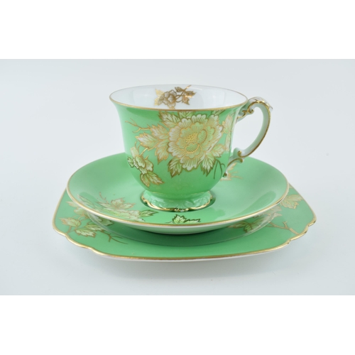 80 - Noritake trio decorated in a floral design with green background and gold highlights (3).