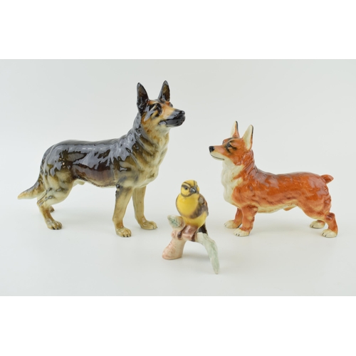 86 - Goebel pottery to include a Corgi, an Alsatian / German Shepherd and a Goldammer (3).