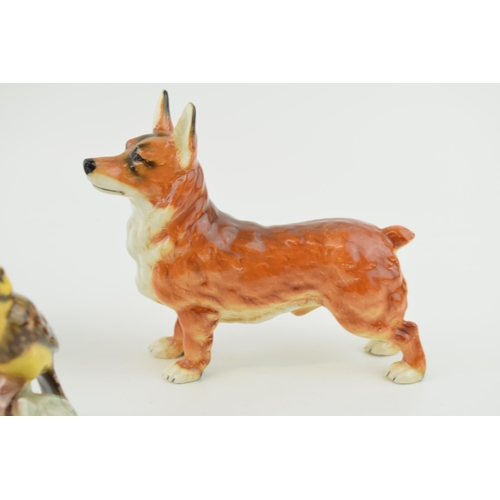 86 - Goebel pottery to include a Corgi, an Alsatian / German Shepherd and a Goldammer (3).