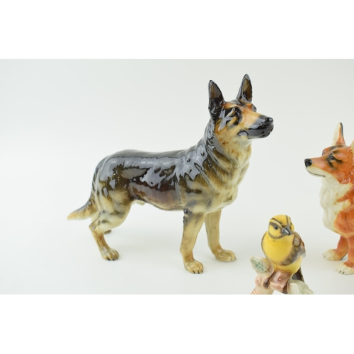 86 - Goebel pottery to include a Corgi, an Alsatian / German Shepherd and a Goldammer (3).