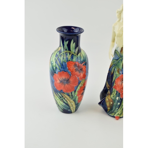 88 - Old Tupton Ware in the Poppy pattern to include a lady holding a flower ,a vase and a ginger jar (3)... 