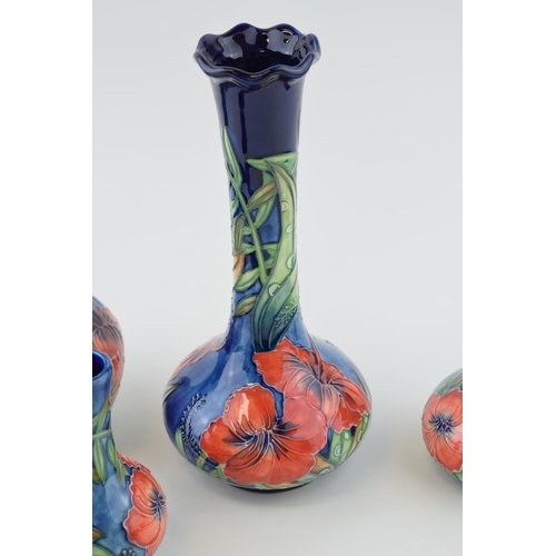 89 - Old Tupton Ware in the Poppy pattern to include four vases of varying heights and styles, 20.5cm tal... 