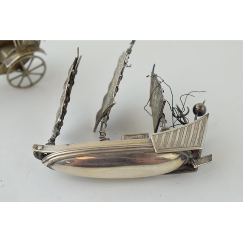 491 - Two white metal (possibly low grade silver) figures of a rickshaw and a galleon, 38.2g, (2).