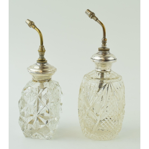 499 - A near pair of silver collared spray scent bottles, stamped sterling, 16cm tall (2).