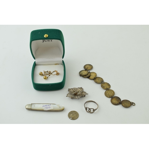 511 - A pair of 9ct yellow gold earrings (1.6 grams) together with pre 1947 silver coins on a bracelet, a ... 