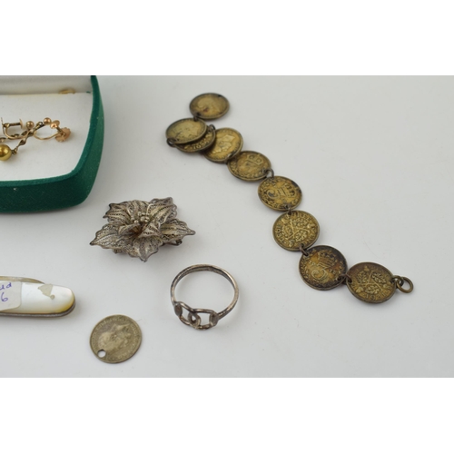 511 - A pair of 9ct yellow gold earrings (1.6 grams) together with pre 1947 silver coins on a bracelet, a ... 