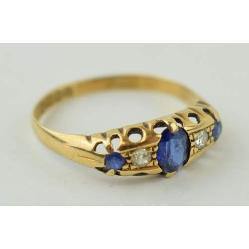 515 - 18ct yellow gold ring set with Diamonds and Sapphires. Large central Sapphire with two Diamonds eith... 