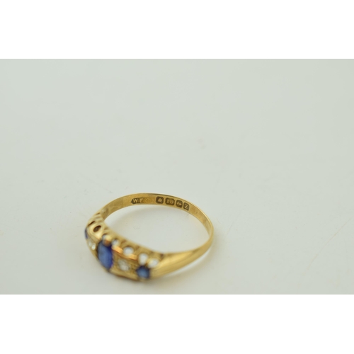 515 - 18ct yellow gold ring set with Diamonds and Sapphires. Large central Sapphire with two Diamonds eith... 