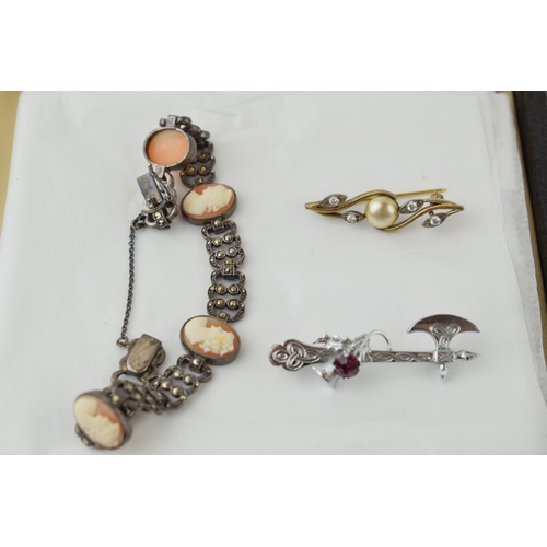 517 - A white metal marcasite bracelet with shell cameos, a gilt silver brooch together with a set of silv... 