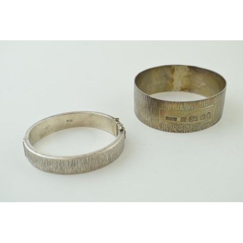 519 - A silver bark effect bangle with a similar bracelet, 69.5g, both hallmarked (2).