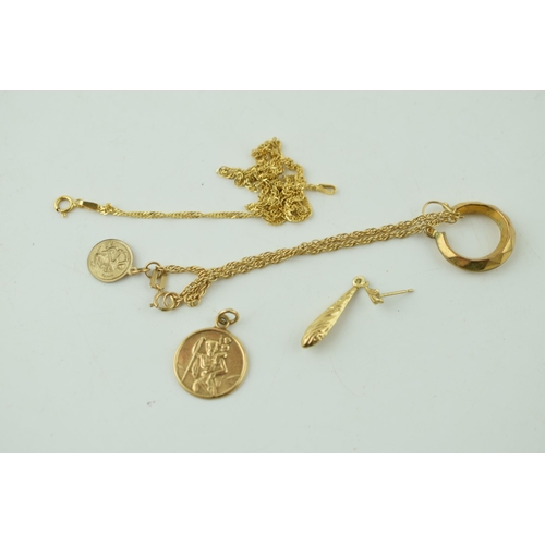 520 - A collection of 9ct gold items to include St Christoper's pendants, and necklaces. Weight 6.6 grams.