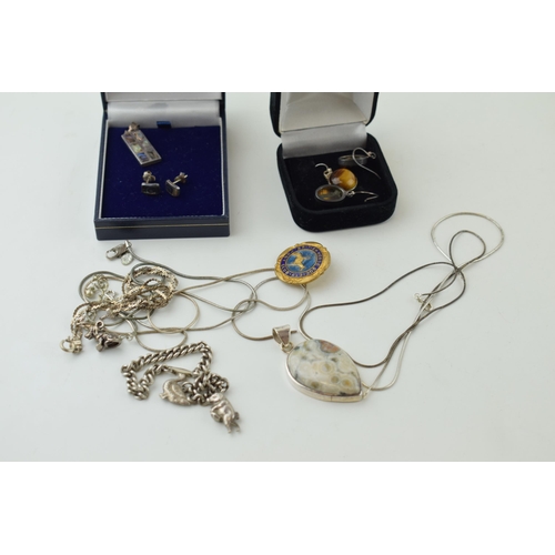 522 - A collection of silver jewellery to include necklaces, earrings and a charm bracelet. together with ... 