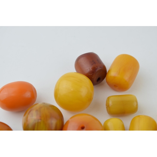 526 - A collection of loose butterscotch amber (or similar) beads, all drilled, circa 186g, varying sizes.