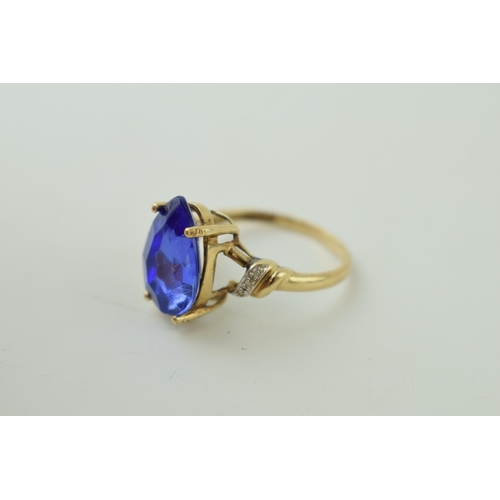 534 - 9ct gold dress ring with semi-precious stone to centre, tear drop shape, illusion set diamond should... 