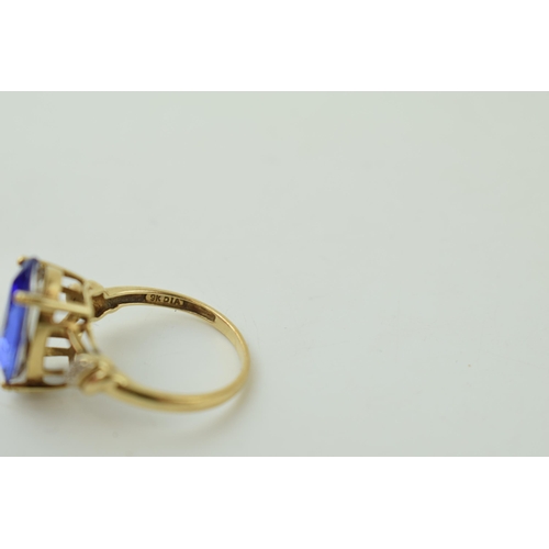 534 - 9ct gold dress ring with semi-precious stone to centre, tear drop shape, illusion set diamond should... 