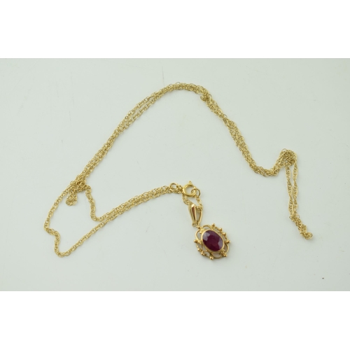 538 - 9ct gold chain and pendant, pink stone, 1.8g, chain 45cm long.