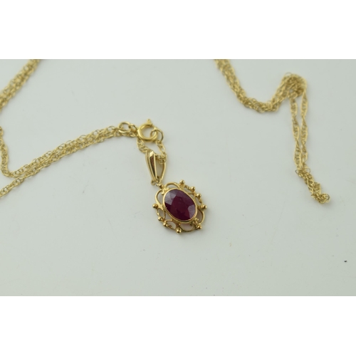 538 - 9ct gold chain and pendant, pink stone, 1.8g, chain 45cm long.