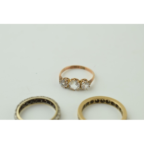 544 - A pair of 9ct gold rings, stone set, one eternity, 4.6g, with a silver and gold eternity ring (3).