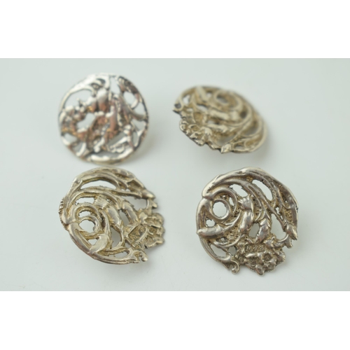 548 - A quartet of silver Art Nouveau buttons, Birmingham hallmark (4), one matched.