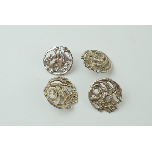 548 - A quartet of silver Art Nouveau buttons, Birmingham hallmark (4), one matched.