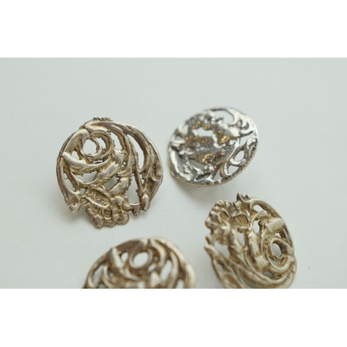 548 - A quartet of silver Art Nouveau buttons, Birmingham hallmark (4), one matched.