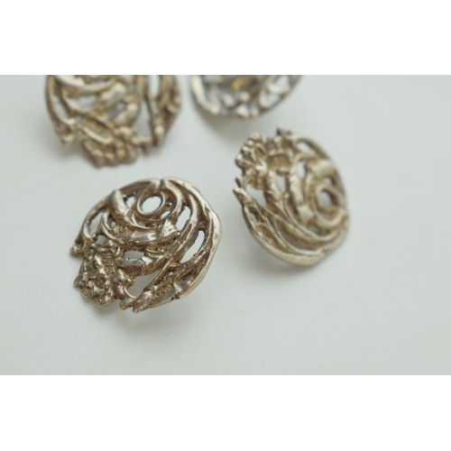 548 - A quartet of silver Art Nouveau buttons, Birmingham hallmark (4), one matched.