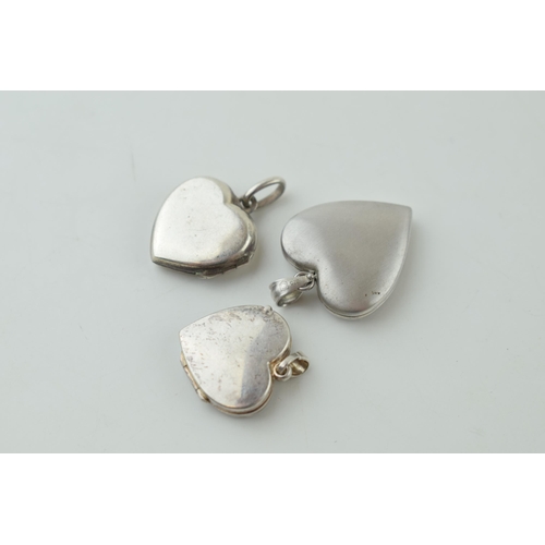 551 - Three silver front and back heart shape lockets, all stone set.