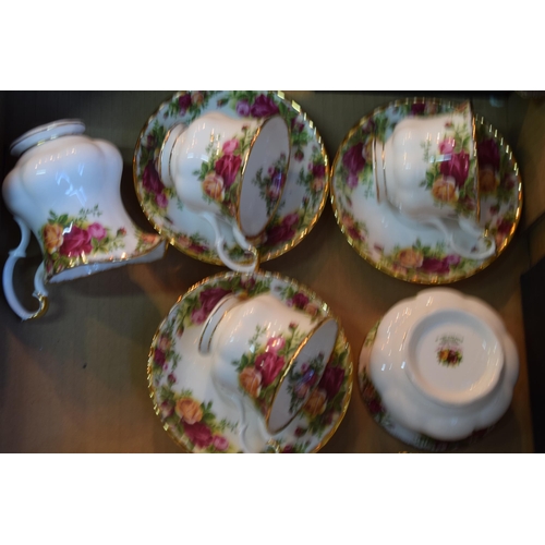 145 - A collection of Royal Albert Old Country Roses tea ware to include six trios, milk and sugar. All of... 