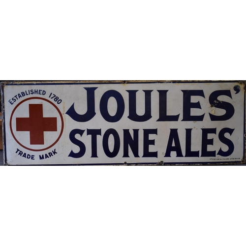 An Early 20th century 'Joules' 'Stone Ale' enamel point of sale brewery / ale advertising sign. White ground with cobalt blue lettering and red trademark cross. Early variant with apostrophe after 'S' of 'Joules' Manufactured by Stainton & Hulme Ltd B'ham. Of local Stone / Staffordshire interest.  76cm x 27cm.