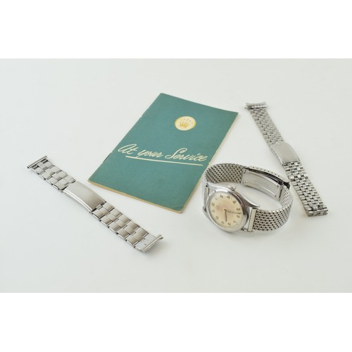 'Rolex Oyster Perpetual' vintage wristwatch. Stainless steel case 36mm  silver tone dial signed, having luminous arabic numerals with logo at 12. Signed crown. Original service card. Together with Rolex stainless steel bracelet.