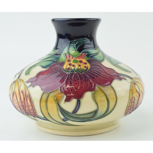 Moorcroft squat vase in the Anna Lily vase, 13cm wide.