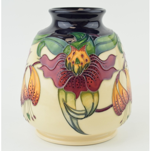 202 - Moorcroft bulbous vase in the Anna Lily design, 14.5cm tall.