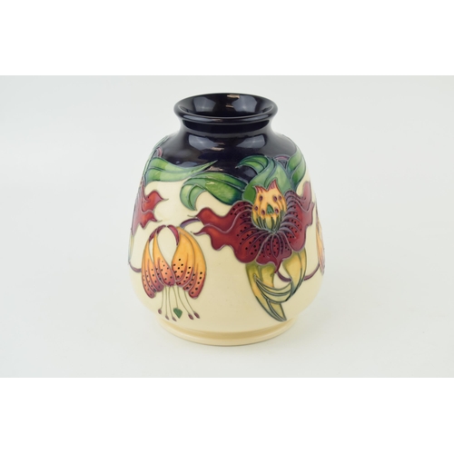 202 - Moorcroft bulbous vase in the Anna Lily design, 14.5cm tall.