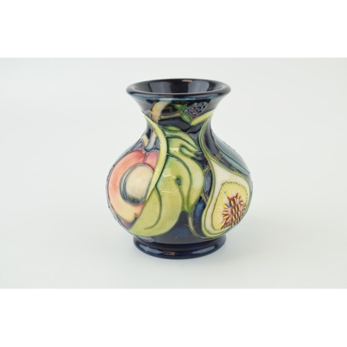 203 - Moorcroft vase in the Queens Choice design, 9.5cm tall.