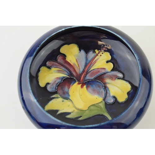 205 - Moorcroft shallow bowl in the Clematis pattern, on blue, 15.5cm wide.